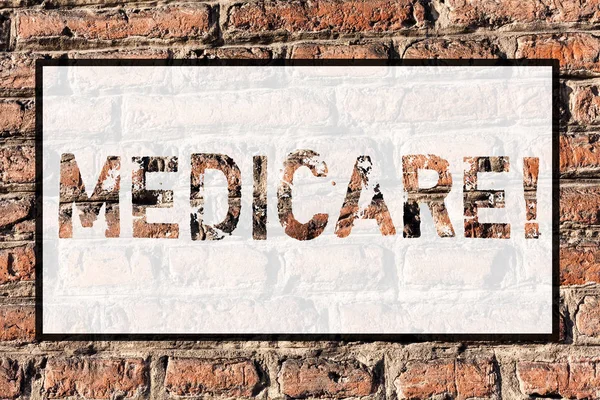 Word writing text Medicare. Business concept for Federal health insurance for showing above 65 or with disabilities Brick Wall art like Graffiti motivational call written on the wall.