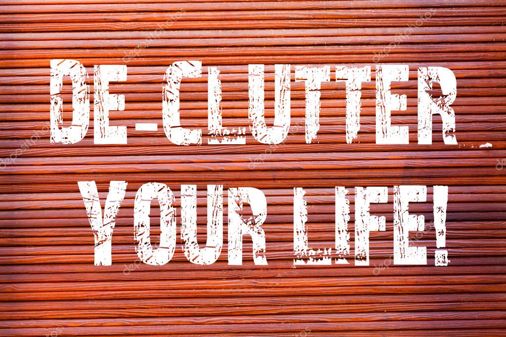 Word writing text De Clutter Your Life. Business concept for remove unnecessary items untidy or overcrowded places Brick Wall art like Graffiti motivational call written on the wall.