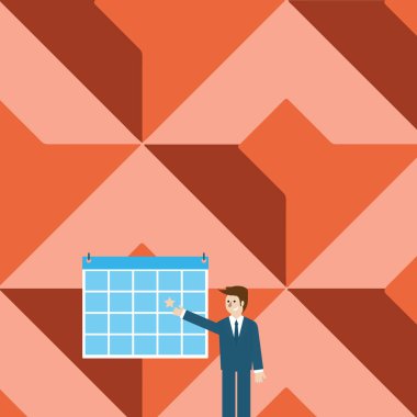 Ayakta ve takvime yıldız ile işaret iş adamı. Renkli ilan panosu duvara asılmış sunan takım elbiseli adam. Yaratıcı arka plan fikir Organzing ve etkinlik planlama.