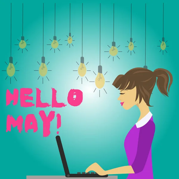 Текст письма Hello May. Бизнес-концепция для приветствия пятого месяца рассматривается в прошлом месяце весеннее фото молодой занятой женщины, сидящей с боковым видом и работающей над ноутбуком . — стоковое фото