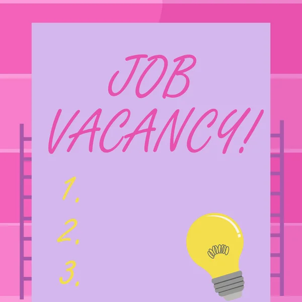 Handwriting text writing Job Vacancy. Concept meaning state of being empty or available job to be taken employer Incandescent Light Bulb with Filament Inside Resting on Blank Color Paper.