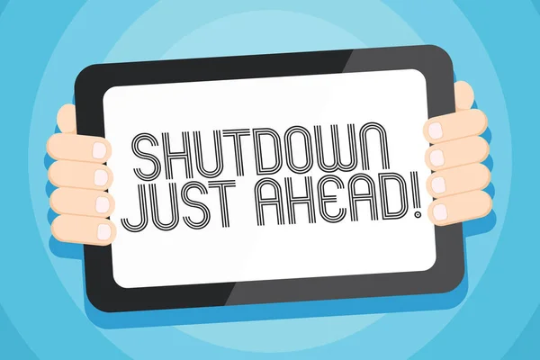 Text sign showing Shutdown Just Ahead. Conceptual photo closing factory business either short time or forever Color Tablet Smartphone with Blank Screen Handheld from the Back of Gadget. — Stock Photo, Image