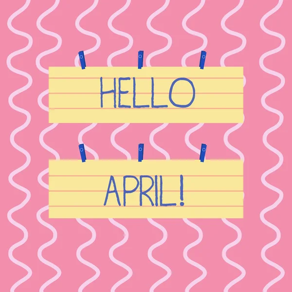 Text sign showing Hello April. Conceptual photo welcoming fourth month of year usually considered spring Two Color Blank Strip Size Lined Paper Sheet Hanging Using Blue Clothespin. — Stock Photo, Image