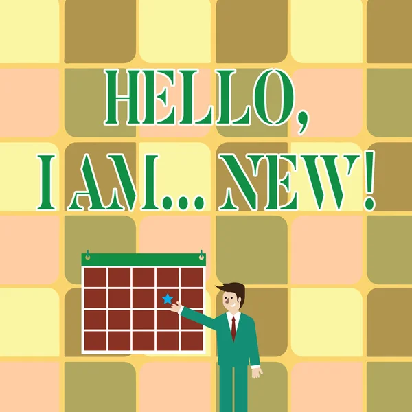 Text sign showing Hello I Am New. Conceptual photo used greeting or begin telephone conversation Businessman Smiling and Pointing to Colorful Calendar with Star Hang on Wall.