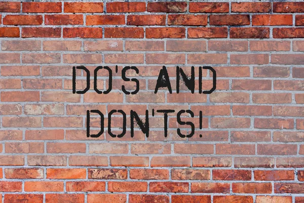 Handwriting text Do S And Don Ts. Concept meaning What can be done and what cannot be knowing right wrong Brick Wall art like Graffiti motivational call written on the wall.