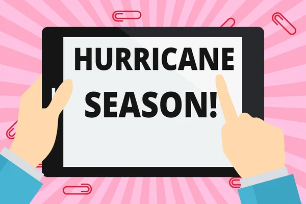 Word writing text Hurricane Season. Business concept for time when most tropical cyclones are expected to develop Hand Holding Pointing Touching Blank Rectangular Color Tablet White Screen.