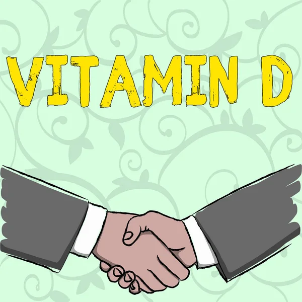 Handskrift text skriver Vitamin D. koncept vilket innebär fördelarna med sunbeam exponering och vissa fettlösliga näringsämnen affärsmän skaka händerna ordentligt som gest Form av hälsning och avtal. — Stockfoto