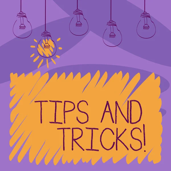 Menulis catatan menunjukkan Tips And Tricks. Tampilan foto bisnis berarti saran, mungkin saran bagaimana meningkatkan Transparent Bulbs Hanging with Filament dan One Lighted Icon . — Stok Foto