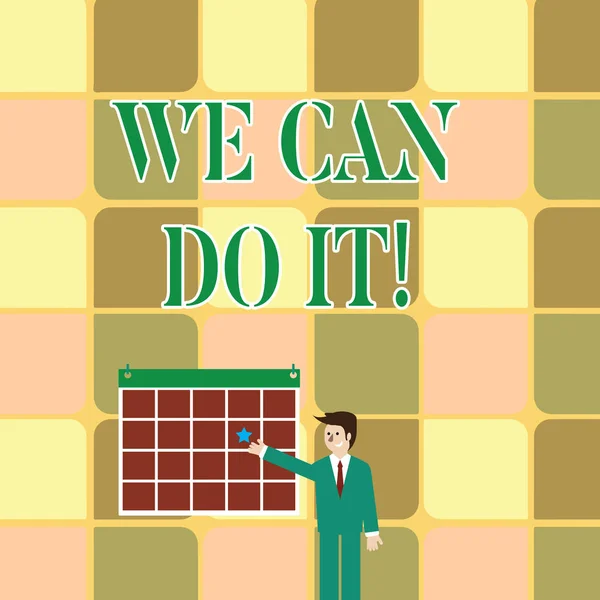 Text sign showing We Can Do It. Conceptual photo see yourself as powerful capable demonstrating Businessman Smiling and Pointing to Colorful Calendar with Star Hang on Wall.