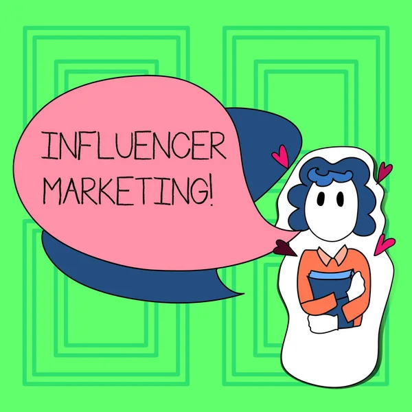 Текст написания слов Influencer Marketing. Бизнес-концепция для концентрации помещается влиятельным показывать, а не целевой книги девушка держит с маленькими сердцами вокруг нее и два цвета речи пузырь . — стоковое фото