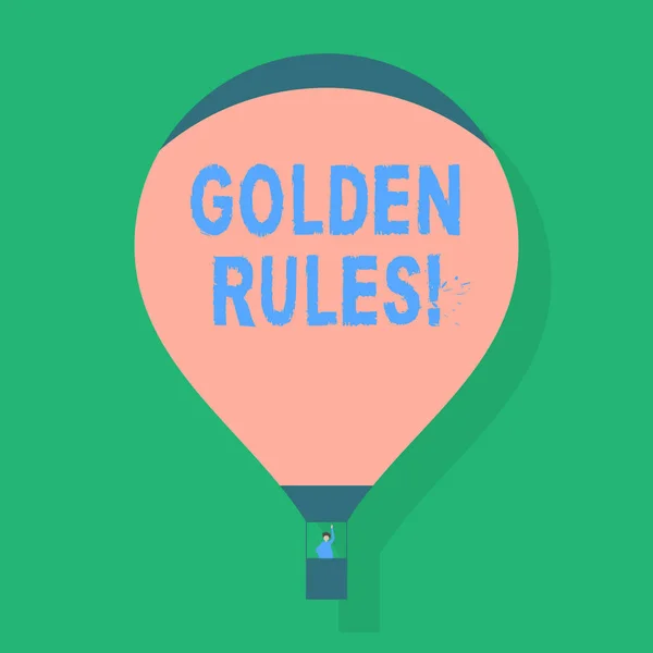 Ordet skriva text gyllene regler. Affärsidé för principen bör följas för att säkerställa framgång i allmän aktivitet tomt rosa varmluft ballong flyter med en passagerare vinka från Gondola. — Stockfoto