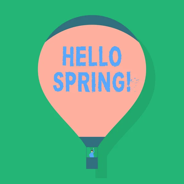 Word writing text Hello Spring. Business concept for Welcoming season comes after winter Blossoming of plantes Blank Pink Hot Air Balloon Floating with One Passenger Waving From Gondola. — Stock Photo, Image