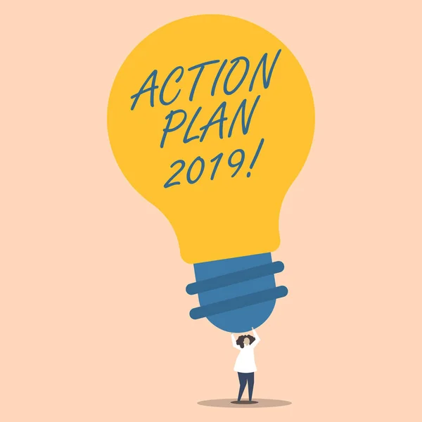 Word writing text action plan 2019. business concept for proposed strategy or course of actions for current year person standing and raise up arms holding big yellow glühbirne for ideas. — Stockfoto