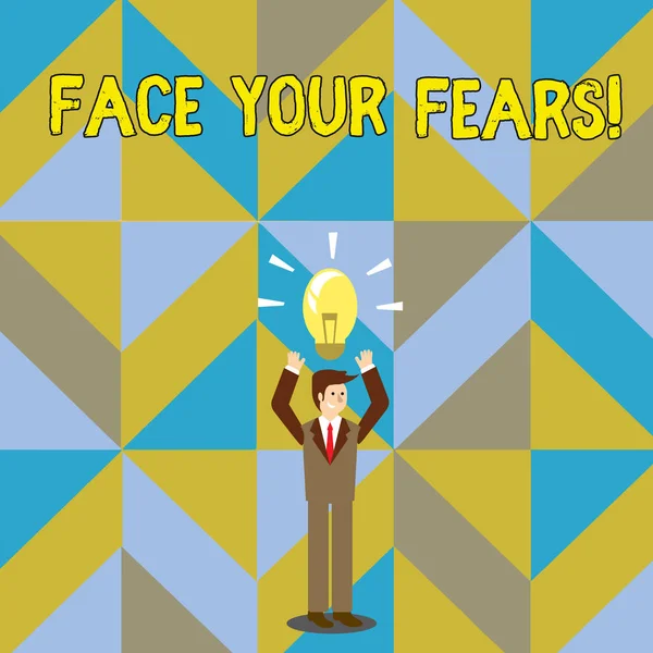 Manuscrito de texto escrevendo Face Your Fears. Conceito significado reconhecer que você está com medo de algo e tentar trabalhar através de Empresário em pé levantando braços para cima com ícone de lâmpada iluminada em sua cabeça . — Fotografia de Stock