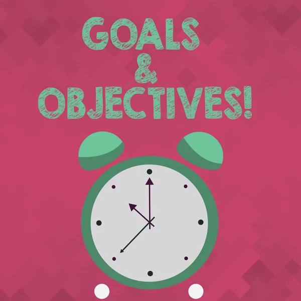 Text sign showing Goals And Objectives. Conceptual photo define strategies or implementation steps attain aims Colorful Round Analog Two Bell Alarm Desk Clock with Seconds Hand photo. — Stock Photo, Image