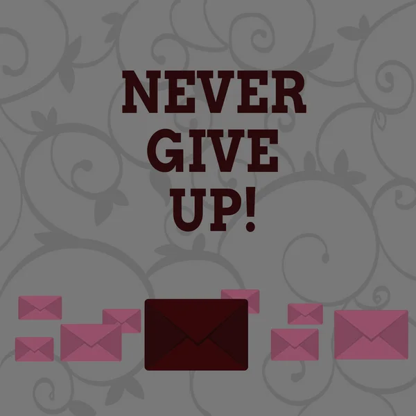 Conceptual hand writing showing Never Give Up. Business photo showcasing you should continue doing what you are good at Resist Color Envelopes in Different Sizes with Big one in Middle.