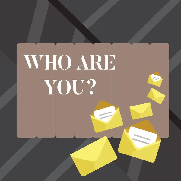 Text sign showing Who Are You question. Conceptual photo asking about demonstrating identity or demonstratingal information Closed and Open Envelopes with Letter Tucked In on Top of Color Stationery. — Stock Photo, Image