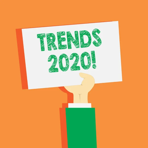 Handschrift tekst schrijven Trends 2020. Concept zin algemene richting waarin iets is het ontwikkelen van volgend jaar Clipart van de hand holding up blanco vel wit papier op pastel achtergrond. — Stockfoto