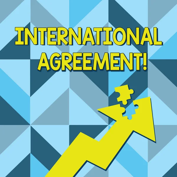 Conceptual hand writing showing International Agreement. Business photo text document signed by countries want make new rules Arrow Pointing Up with Detached Part Jigsaw Puzzle Piece. — Stock Photo, Image