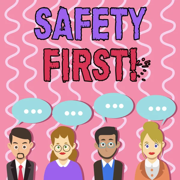 Text sign showing Safety First. Conceptual photo best avoid any unnecessary risks and act so that you stay safe Group of Business People with Blank Color Chat Speech Bubble with Three Dots.