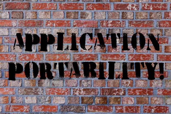 Text sign showing Application Portability. Conceptual photo software designed moved from one environment another Brick Wall art like Graffiti motivational call written on the wall.