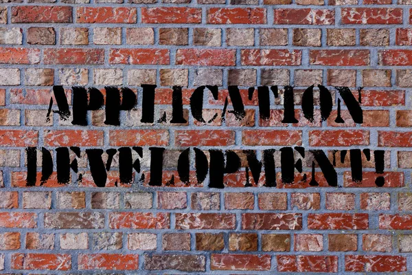 Text sign showing Application Development. Conceptual photo process of creating computer phone programs Brick Wall art like Graffiti motivational call written on the wall.