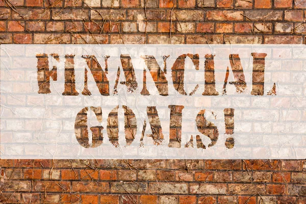 Word writing text Financial Goals. Business concept for targets usually driven by specific future financial needs Brick Wall art like Graffiti motivational call written on the wall.