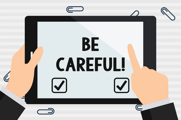 手写文本要小心。概念含义, 确保避免潜在的危险事故或伤害手持有指向触摸的空白矩形彩色平板电脑白色屏幕. — 图库照片