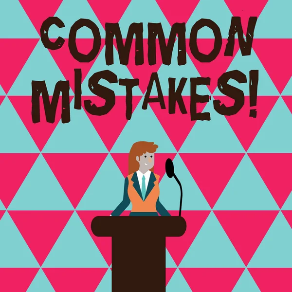 Conceptual hand writing showing Common Mistakes. Business photo text repeat act or judgement misguided making something wrong Businesswoman Behind Podium Rostrum Speaking on Microphone. — Stockfoto