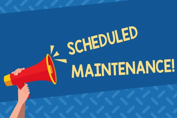 Handwriting text Scheduled Maintenance. Concept meaning predetermined maintenance carried out at regular time Human Hand Holding Tightly a Megaphone with Sound Icon and Blank Text Space.