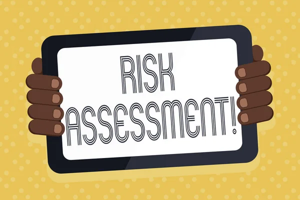 Word writing text Risk Assessment. Business concept for evaluating potential risks involved projected activity Color Tablet Smartphone with Blank Screen Handheld from the Back of Gadget.