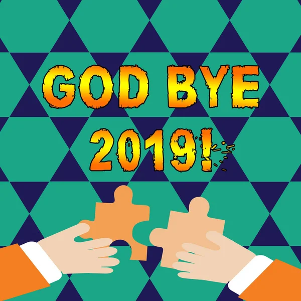 Conceptual hand writing showing God Bye 2019. Business photo showcasing express good wishes when parting or at the end of last year Hands Holding Jigsaw Puzzle Pieces about Interlock the Tiles.