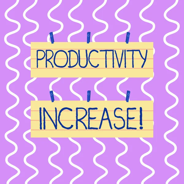 Conceptual hand writing showing Productivity Increase. Business photo showcasing Labor productivity growth More output from worker Strip Size Lined Paper Sheet Hanging Using Blue Clothespin.