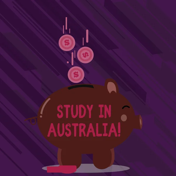 Word writing text Study In Australia. Business concept for going into foreign country order complete your studies Color Piggy Bank Sideview and Dollar Currency Coins Falling Down to the Slit. — Stock Photo, Image