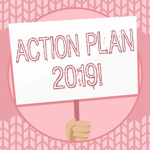 Writing note showing Action Plan 2019. Business photo showcasing proposed strategy or course of actions for current year Hand Holding White Placard Supported for Social Awareness.