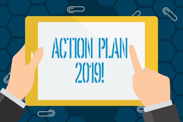 Conceptual hand writing showing Action Plan 2019. Business photo showcasing proposed strategy or course of actions for current year Businessman Hand Holding and Pointing Colorful Tablet Screen.