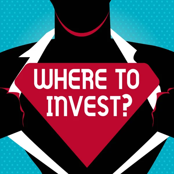 Text sign showing Where To Invest question. Conceptual photo asking about actions or process of making more money Man in Superman Pose Opening his Shirt to reveal the Blank Triangular Logo.