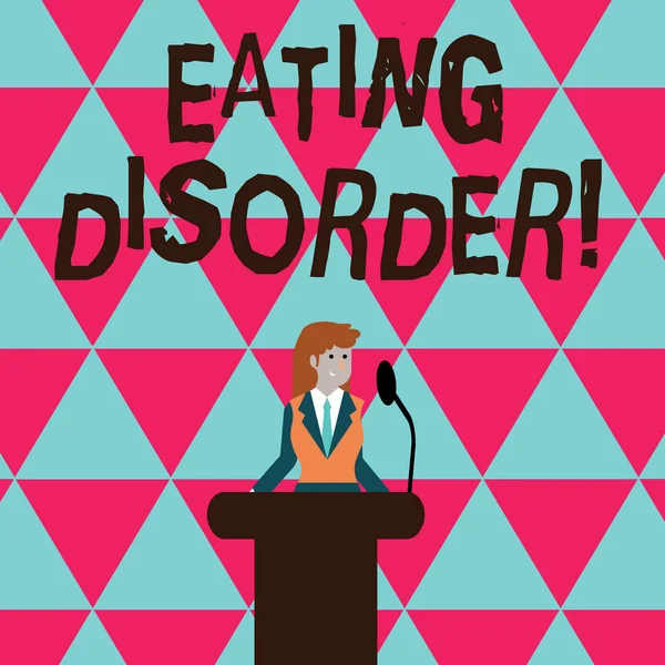 Conceptual hand writing showing Eating Disorder. Business photo text characterized by abnormal or disturbed eating habits Businesswoman Behind Podium Rostrum Speaking on Microphone.