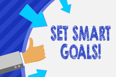 Akıllı Hedefleri ayarlama gösteren kavramsal el yazma. İş fotoğraf vitrine liste fikirler odak çabaları zaman akıllıca el gesturing thumbs yukarı ve tutarak yuvarlak şekil oklar ile kullanmak açıklığa kavuşturmak.