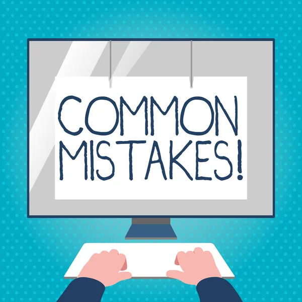 Text sign showing Common Mistakes. Conceptual photo repeat act or judgement misguided making something wrong Hands on Mockup Keyboard Front of Blank White Monitor with Screen Protector. — Stock Photo, Image