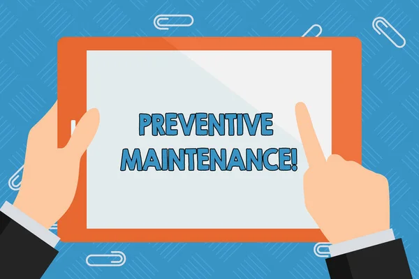 Conceptual hand writing showing Preventive Maintenance. Business photo showcasing Routine maintenance to help keep equipment up Businessman Hand Holding and Pointing Colorful Tablet Screen.