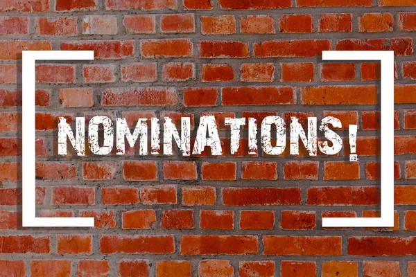Texto manuscrito Nominaciones. Concepto que significa acción de nominación o estado siendo nominado para el premio Brick Wall art como Graffiti llamada motivacional escrita en la pared . — Foto de Stock