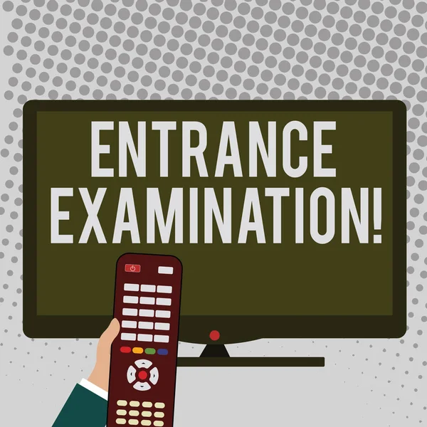 Handwriting text writing Entrance Examination. Concept meaning an exam that you take to be accepted into a school Hand Holding Computer Remote Control infront of Blank Wide Color PC Screen.