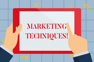 Text sign showing Marketing Techniques. Conceptual photo business s is overall game plan for reaching showing Hand Holding Pointing Touching Blank Rectangular Color Tablet White Screen.