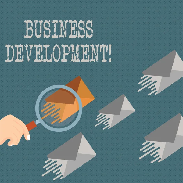 Writing note showing Business Development. Business photo showcasing pursuing strategic opportunities for a certain business Magnifying Glass on Color Envelope and others has Same Shade. — Stock Photo, Image