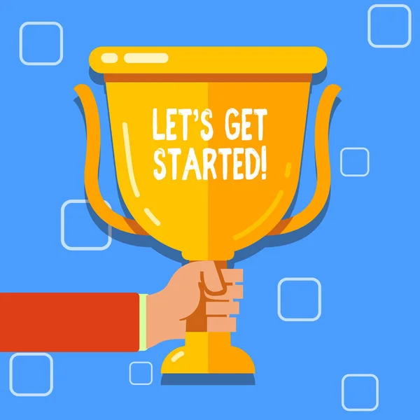 Writing note showing Let S Get Started. Business photo showcasing encouraging someone to begin doing something Hand Holding Championship Winners Cup Trophy with Reflection. — Stock Photo, Image