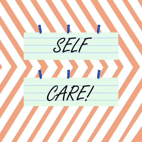 Writing note showing Self Care. Business photo showcasing practice of taking action preserve or improve ones own health Strip Size Lined Paper Sheet Hanging Using Blue Clothespin. — Stock Photo, Image