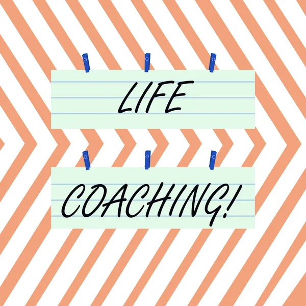 Writing note showing Life Coaching. Business photo showcasing demonstrating employed to help showing attain their goals in career Strip Size Lined Paper Sheet Hanging Using Blue Clothespin.
