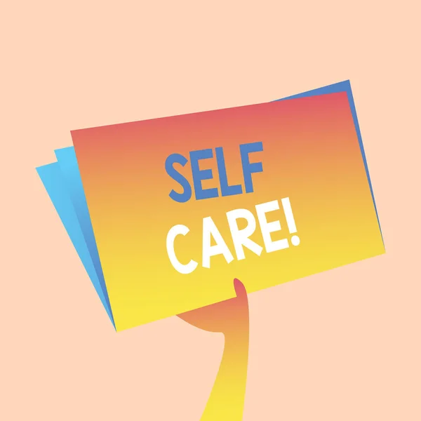 Handwriting text writing Self Care. Concept meaning practice of taking action preserve or improve ones own health Hand Holding and Raising Blank Space Colorful File Folder with Sheet Inside. — Stock Photo, Image