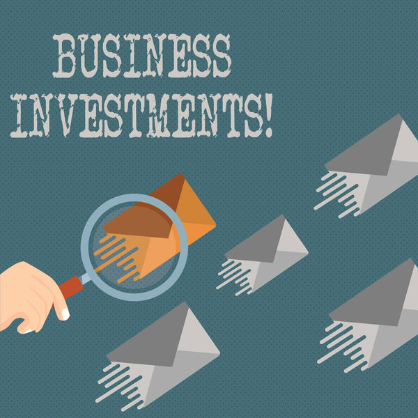 Writing note showing Business Investments. Business photo showcasing act of committing money or capital to an endeavor Magnifying Glass on Color Envelope and others has Same Shade.